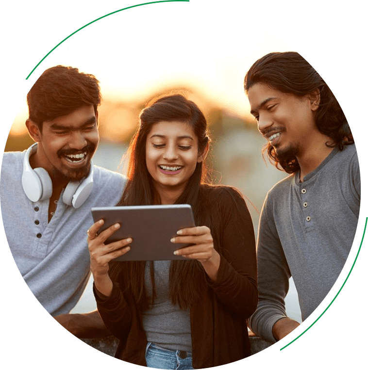 Three people are looking at a tablet.